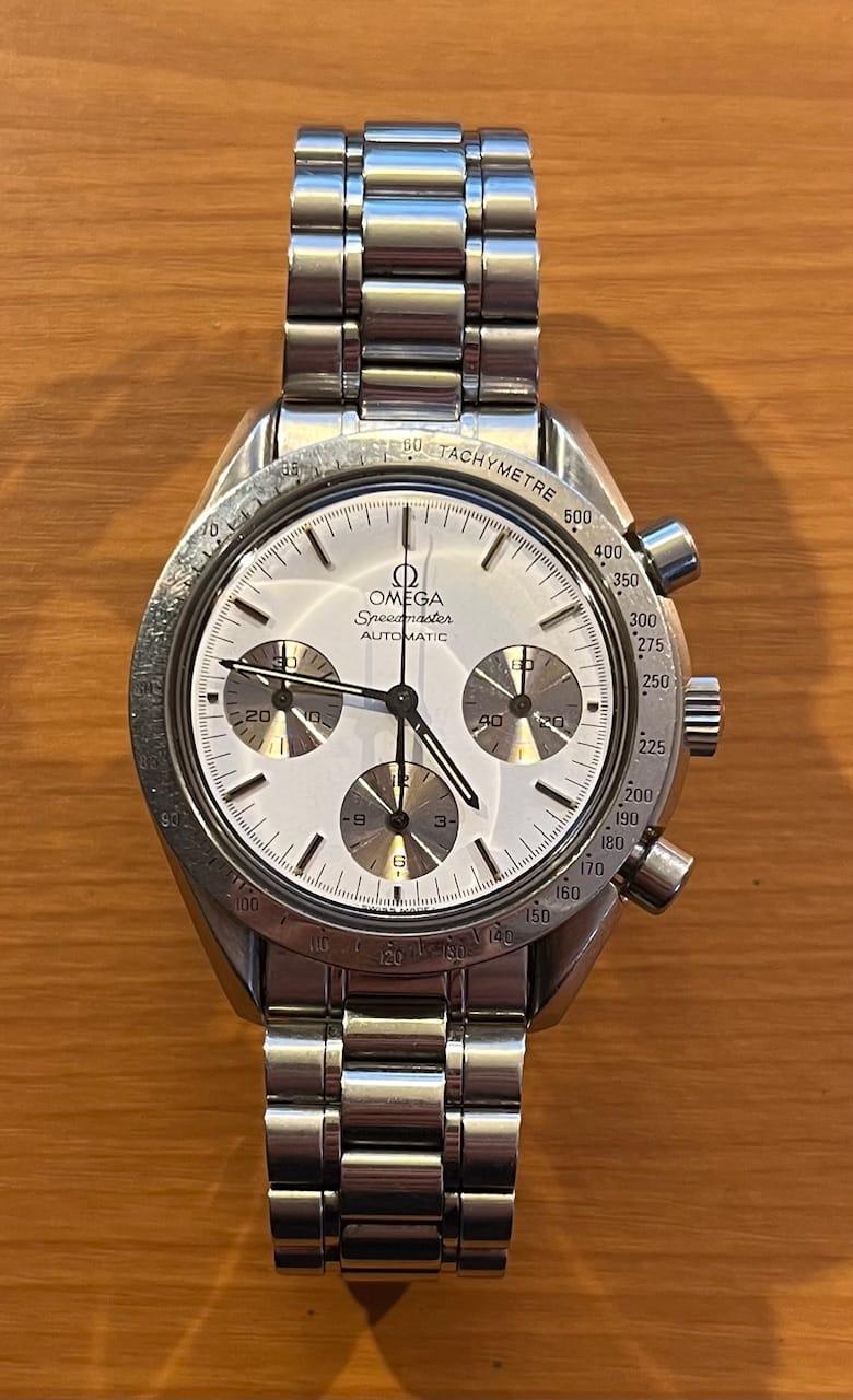 Rare Speedmaster Reduced with steel bezel and black paint filled markers, white dial and sunbrushed chronograph subdials. Omega Speedmaster Reduced 175.0032